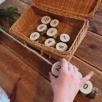 Woodburned Numbers Threading with Needle