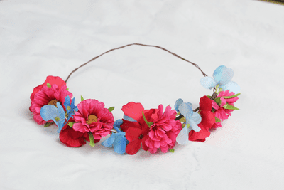 Artificial pink, blue, red festival flower crown
