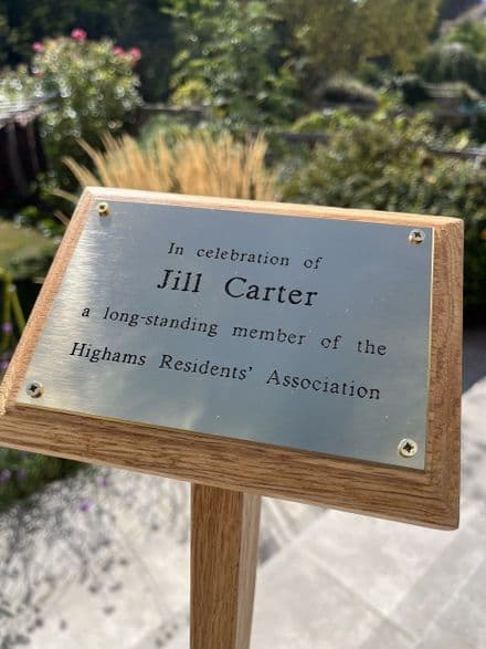 Engraved brass memorial plaque with wood stake