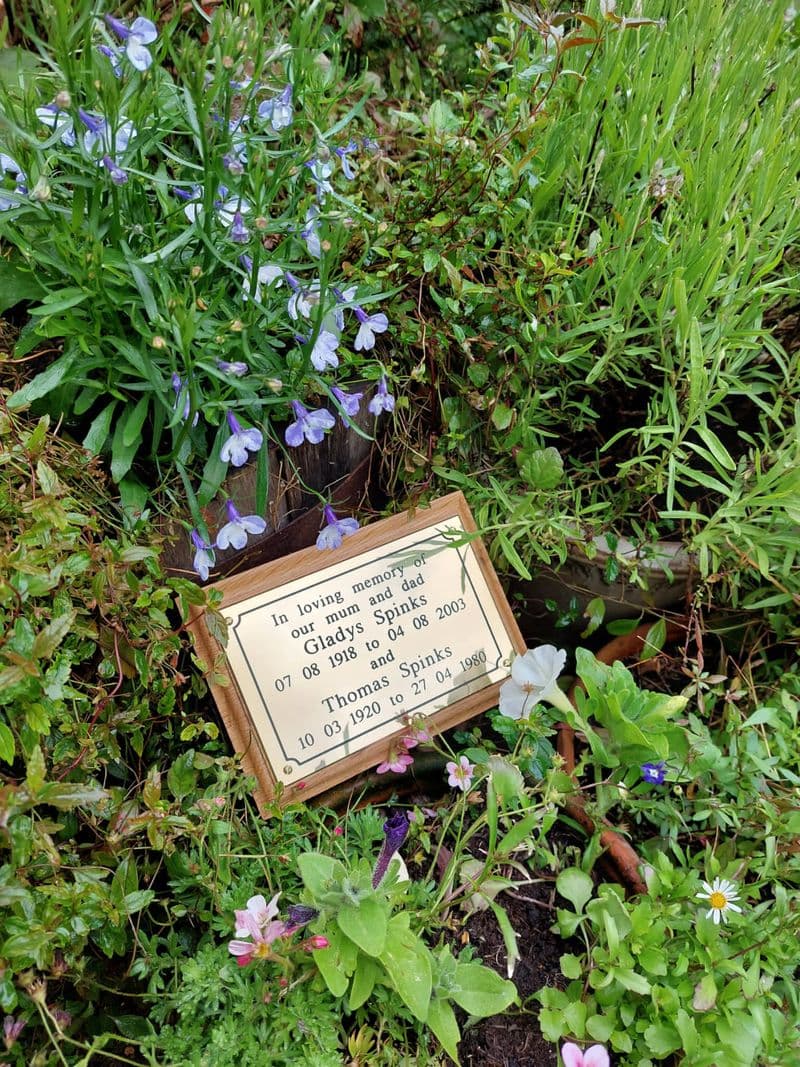 Engraved brass memorial plaque with wood stake