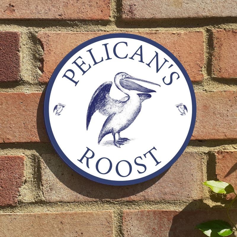 Pelican round house or beach hut sign