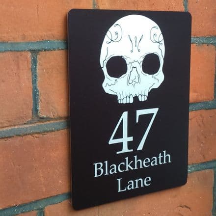 Skull house sign or wall plaque