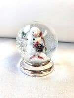Snowman Snow Globe with silver foot.