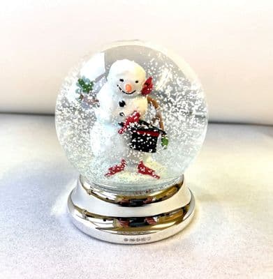 Snowman Snow Globe with silver foot.