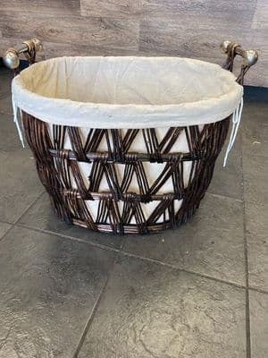 Large oval dark brown finish basket with removeable liner