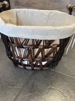 Medium oval dark brown finish basket with removeable liner