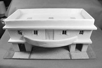 No 3 One storey big D balcony building.