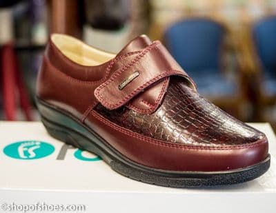 An extra soft and extra wide velcro deep wine leather shoe