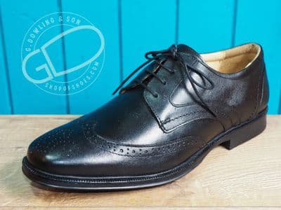 Leather Brogue in black with comfort footbed and flexible rubber sole.