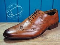 Leather Brogue in tan with flexible leather look sole.
