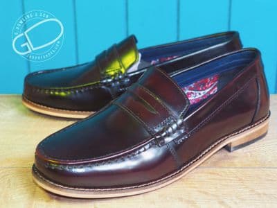 Modern high shine real leather loafer with  hard wearing leather look sole.