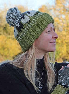Green Knitted Bobble Hat With A Black Sheep And Fleece Lining