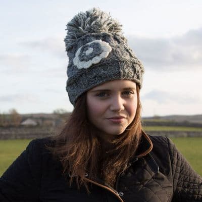 Grey knitted bobble hat with flower