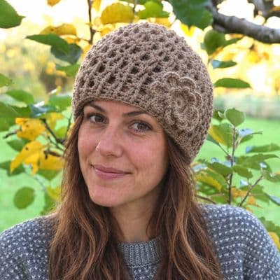 Light brown beanie with crochet flower