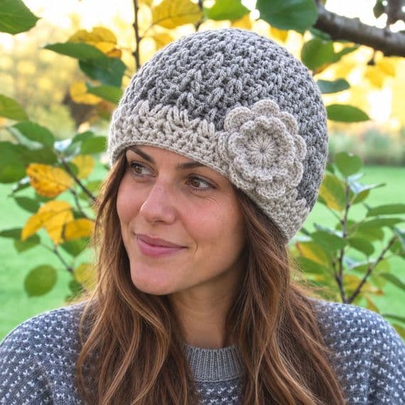 Light grey beanie with light grey border and flower