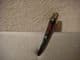 Concord  hair clip in dark brown with flowers.