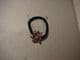 Hair band ponytail holder flower in pink cyrstals.