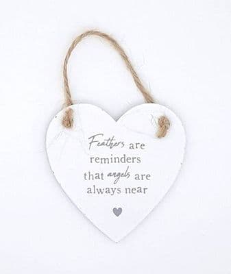 Feathers are reminders that angels are always near wooden heart sign