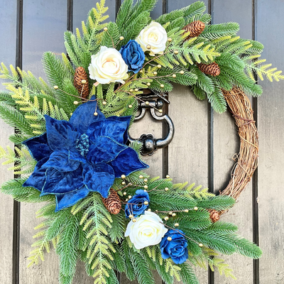Crescent Style Christmas Wreath with a large Blue Poinsettia, Cream and Blue Roses, on a Pine Base