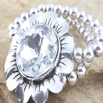 Over-Sized Metal Flower Bracelet with large facetted Rhinestone on a double row bead bracelet