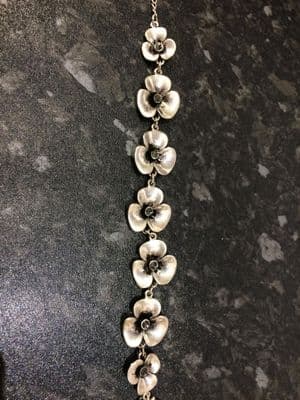 Silver Colour Bracelet with Crystal Flower Heads and crystals in the centre of the flowers