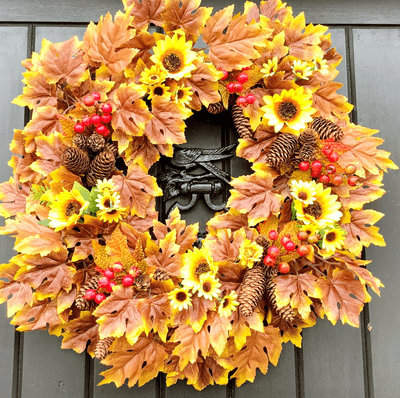 Yellow Sunflowers, Red Berries, Pinecones presented on Brown and Yellow Maple Leaves Wreath