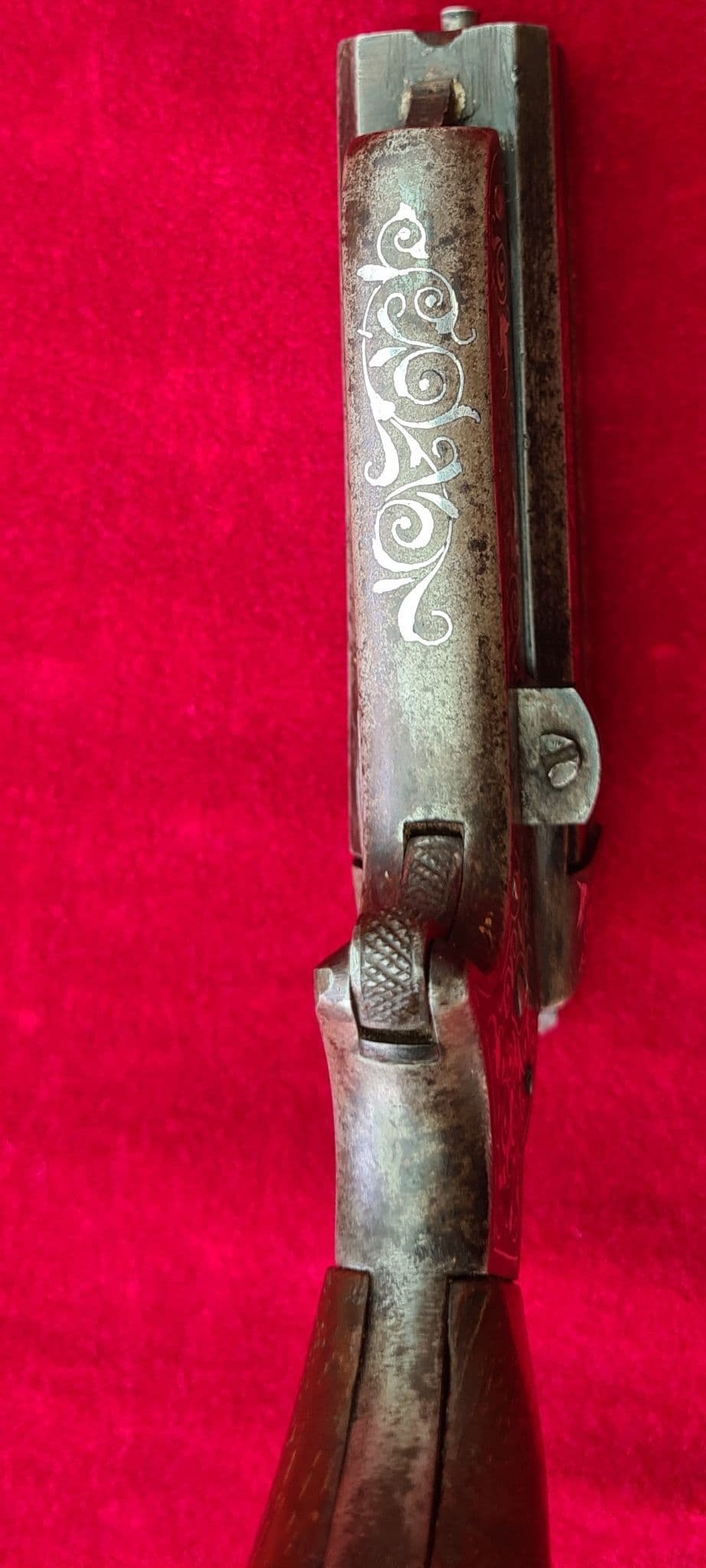 A very fine example of a silver inlaid four barrel 32 cal rimfire