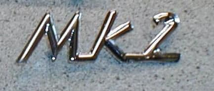 SPITFIRE CHROME MK 2 SCRIPT SCROLL BADGE 618242 INC FIXINGS