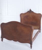 Antique French walnut bed frame