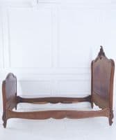 Antique French walnut bed frame