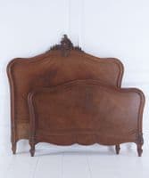 Antique French walnut bed frame