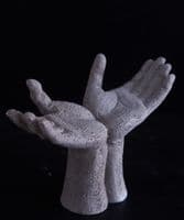 Open hands sculpture