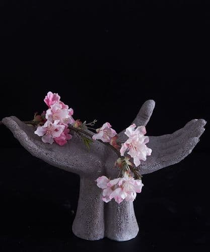 Open hands sculpture