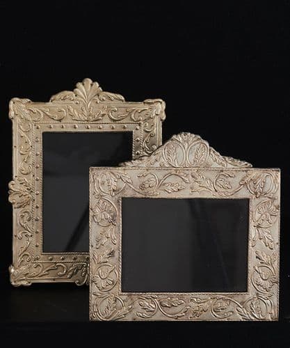 Pair of antiqued silver repoussé standing frames - SOLD