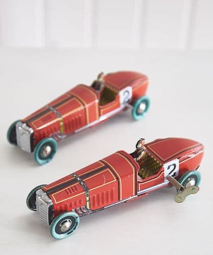 Pair of wind-up metal racing cars