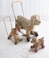 Small pull-along dog on wheels
