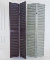 Tall louvred distressed French green shutters