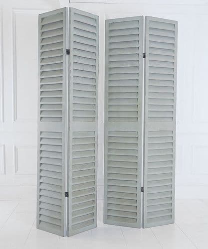 Tall louvred distressed French green shutters