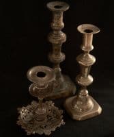 Three assorted brass candlesticks