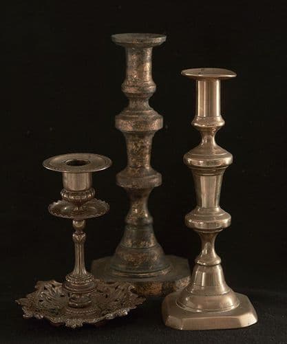 Three assorted brass candlesticks