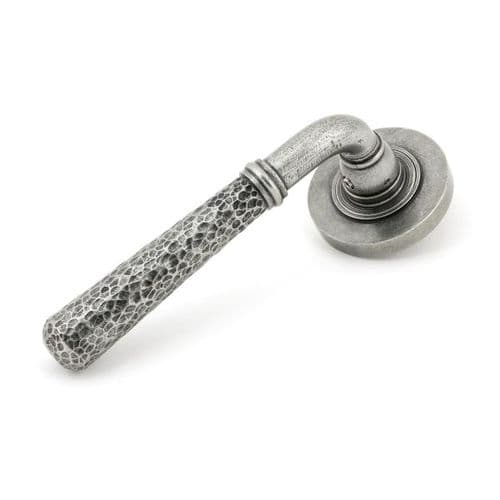 From the Anvil Hammered Newbury Door Handle on Plain Rose - Pair - Pewter Patina - 45655