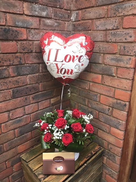12 top quality roses +small box of Chocolate + balloons "I Love You"