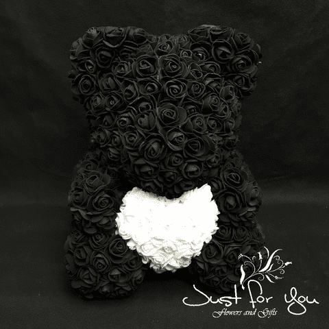 Medium black teddy with white heart in Presentation box