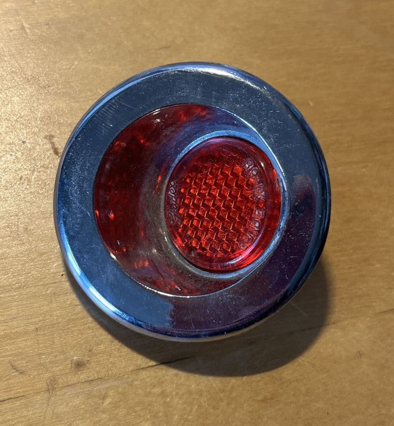 1958-61 door panel  REFLECTOR GM 3747403  inc nut  Used