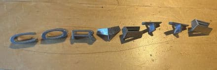 1968-1973 C3 Corvette, rear panel emblem LETTERS , GM 3927979 patinated OEM used