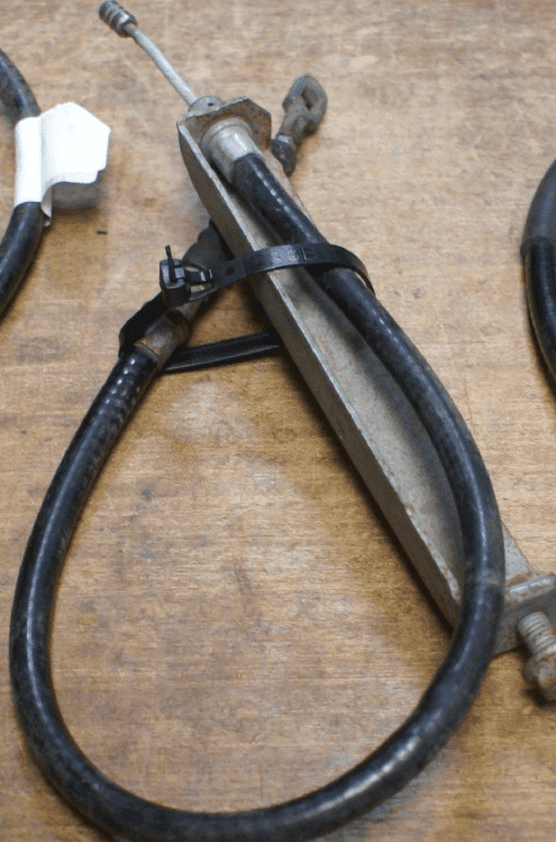 1989-96 Parking Brake Cable W/Bracket,Rear,OEM,Used