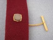 1970's signed SOPHOS grey shell and gold plated tie tack.