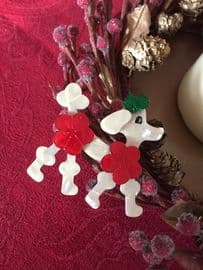 A Lea Stein Christmas Poodle with Red Pom Pom Hairdo and Green Bow