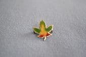 A Miniature Canada Souvenir Pin - Silver and Enamel Maple Leaf  - Yellow Middle