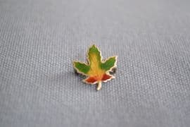 A Miniature Canada Souvenir Pin - Silver and Enamel Maple Leaf - Yellow Middle